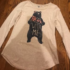 a long sleeved shirt with a pink and navy bear